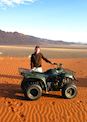 Kirsty quad biking in the NamibRand, Namibia